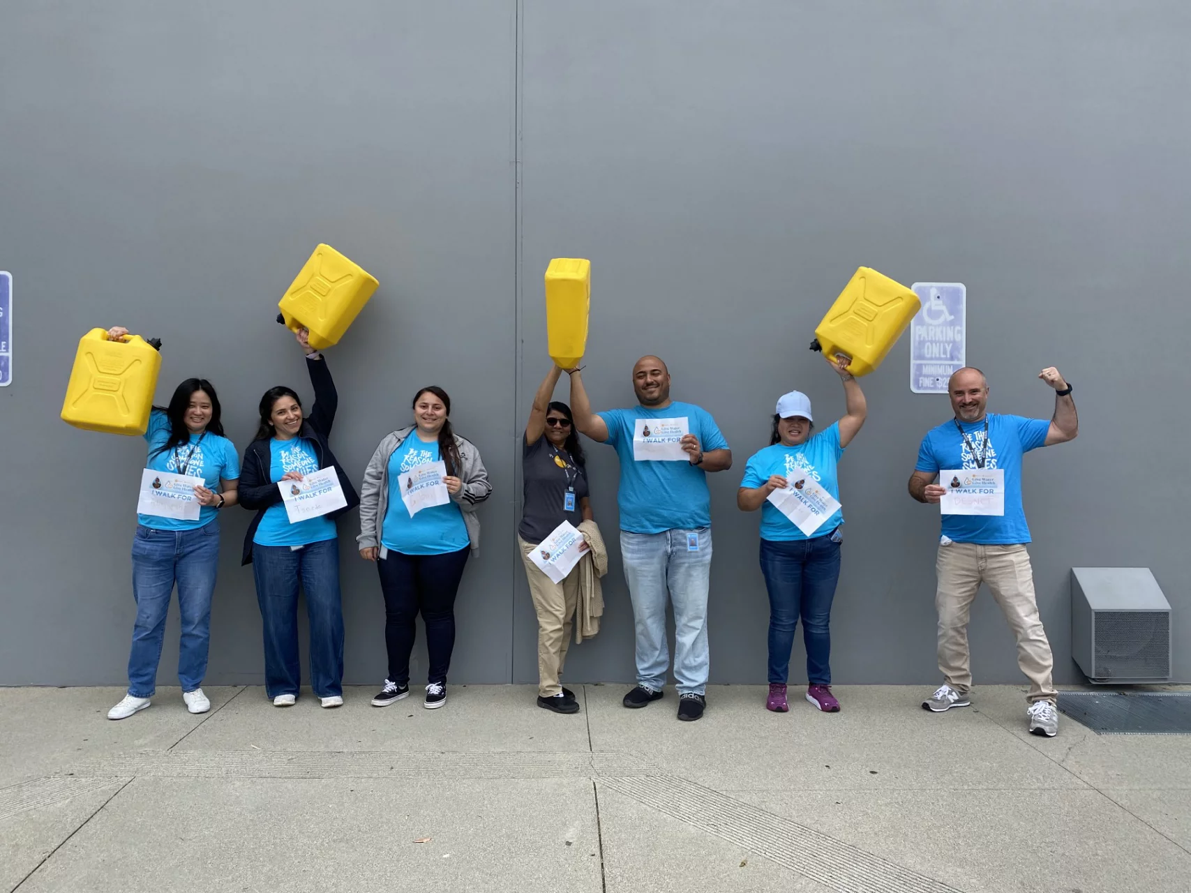 Volunteer team with water jubs